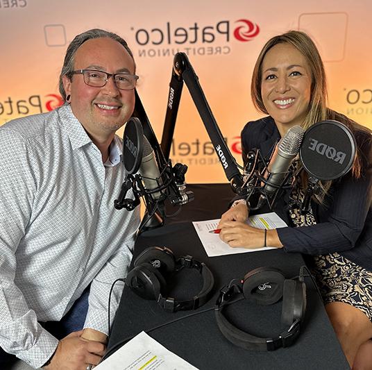 Patelco Employees Michele Enriquez and Joseph Luque at the podcast desk.